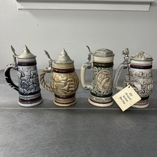 Avon 1976, 1977, 1978 and 1979 Beer Steins. Mix transportation and animal themes picture