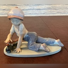 Adorable Porcelain Lladro of a Boy playing w/a Toy Train in glossy pastel colors picture