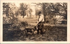 Vintage Real Photo Postcard Boy with Dog in Spring Garden CYKO RPPC picture