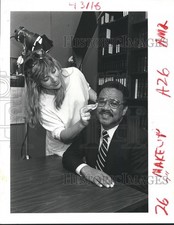 1985 Press Photo Councilman Lambert Bossiere prepares for TV commercial picture