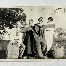 Vintage Snapshot Photograph Man & Women Fun Odd Overalls Full Of Apples Farm picture