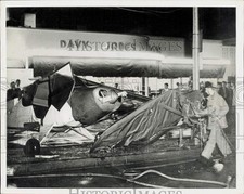1947 Press Photo Firemen work on a plane, crash-landed in downtown Pasadena, CA picture