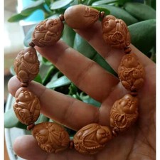 1.7*2.4cm Olive Carved Core The Eight Maitreya Buddhas Olive Hu Zhaocai Bracelet picture