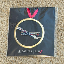 Delta Air Lines 2026 BCRF Airplane Christmas ornament - Badges & Pins picture