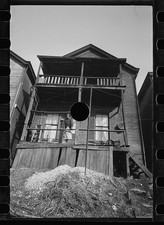 Photo:1930s Slum Housing Women on Porch Balconies Carl Mydans picture