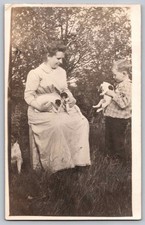 c1910 Woman & Boy With Jack Russell Puppies In Yard RPPC Real Photo Postcard picture
