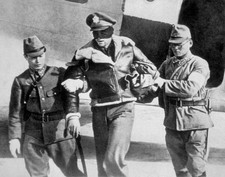 An American airman who took part in a raid over Tokyo is led away - Old Photo picture