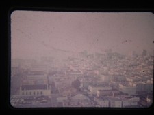RH16 BUS, STREETCAR, SUBWAY TROLLY 35MM slide BLURRY AERIAL VIEW OF CITY AUG 75 picture