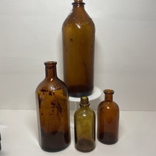 Lot Of 4 Antique VTG Mixed Use Amber Bottles Marked On Bottom 2 Large 2 Small picture