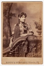 PRETTY YOUNG WOMAN WITH LONG BRAID & PLAID DRESS: TANDY & BURNSIDE,LINCOLN, ILL. picture