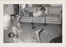 Vintage 1954 Snapshot Photo Girls Reading Comic Books Couch Living Room Floor picture
