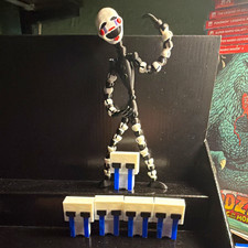 Puppet action figure with the  5 of the crying children  picture