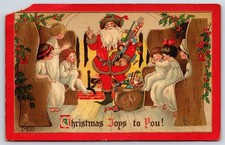 1914 Christmas Joys Santa Children Tuck's Antique Postcard picture