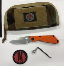 Strider Knives SnG DGG Satin Magnacut Blade Orange G10 Show Side With Extras picture