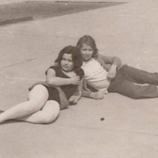Two Young Girls Sharing A Carefree Afternoon Dreamy Friendship Vintage Photo picture