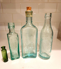 Lot of 4 Vintage Embossed Glass Bottles Aqua & Green incl. E.B. Miller Medical picture