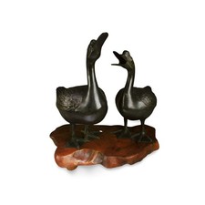Two Bronze Duck Statues. Comes fitted with a wooden stand picture