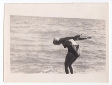 Faceless woman Diver Swimmer Dive shot Rear view Beach Sports Blurred odd photo picture