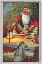 Antique Santa Claus Christmas Postcard Filling Stocking w/ Toys c1910s picture