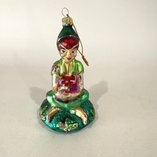 Vintage Peter Pan Glass Christmas Ornament Seated Figure with Gift Green Red picture