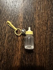 Vintage 1980s Bell Charm Baby Bottle Yellow Clip On picture