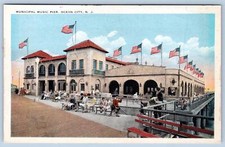1920-30's OCEAN CITY NJ MUNICIPAL MUSIC PIER AMERICAN FLAG MOWEN STUDIO POSTCARD picture