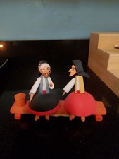 Hand Carved Painted Wood Romanian Folk Art Figurine two nuns setting on a bench picture