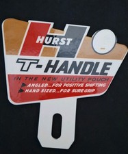 Hurst T-HANDLE Shifter Advertising Porcelain Enamel & Steel License Plate Topper picture