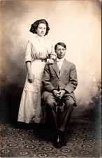 Postcard Real Photo RPPC Young Man in Suit & Woman with Bow in Hair picture