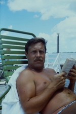 c1970's 35mm Slide, Man Reading Book Beach Chair Vacation green blue Color Photo picture