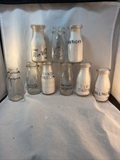 9 Embossed Half Pint Milk Bottles picture