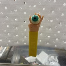 Vintage Flesh Colored Psychedelic Hand with Eye Purple Stem PEZ Candy Dispenser picture