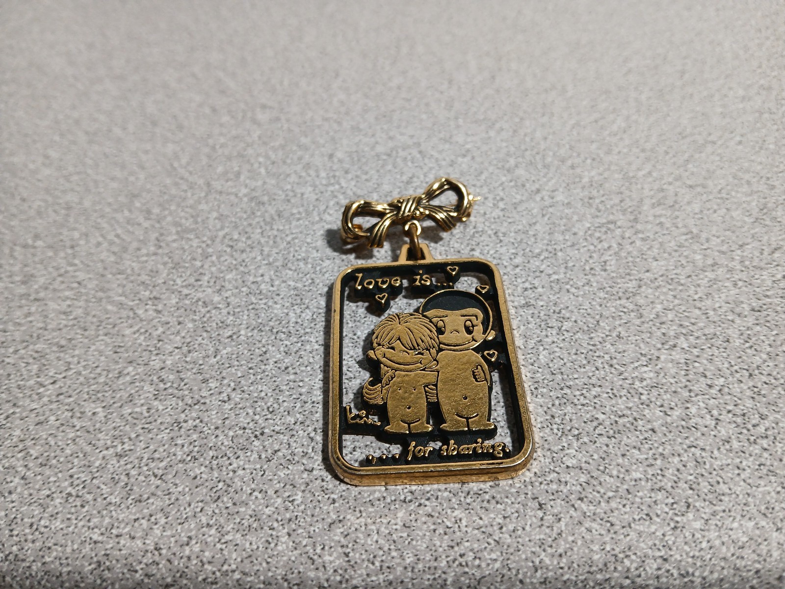 Vintage 1970s LOVE IS For Sharing Gold Tone Pin Brooch by KIM CASALI Bow 