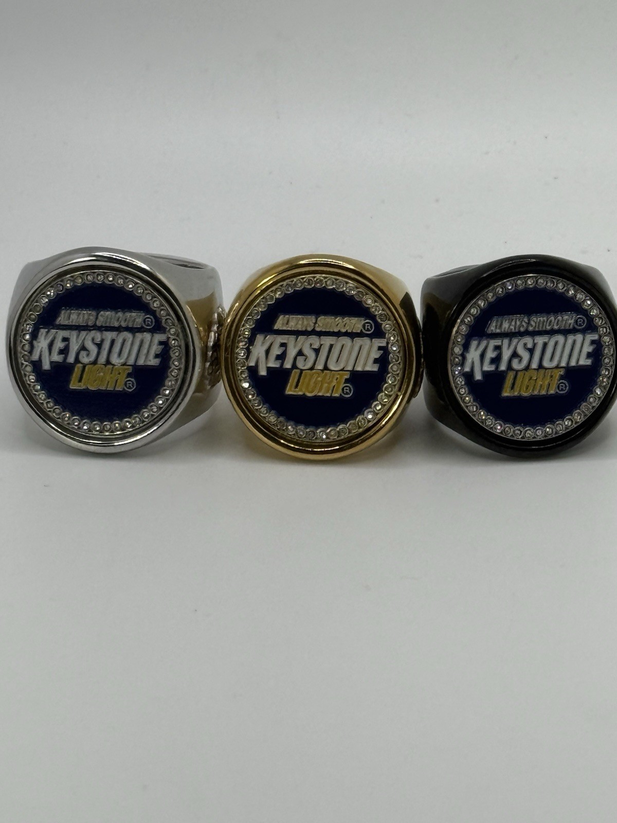 The KEYSTONE LIGHT deCAPitator Ring Bottle Cap And Can Tab Opener