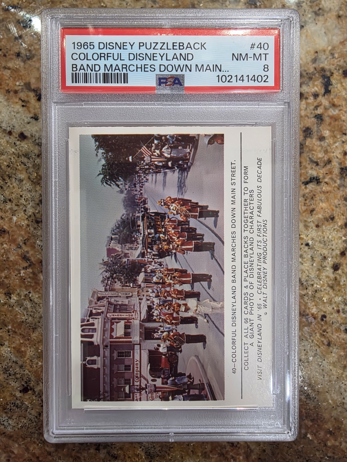 1965 DISNEYLAND PUZZLEBACK #40 Disney Colorful Disneyland Marches Down- PSA 8