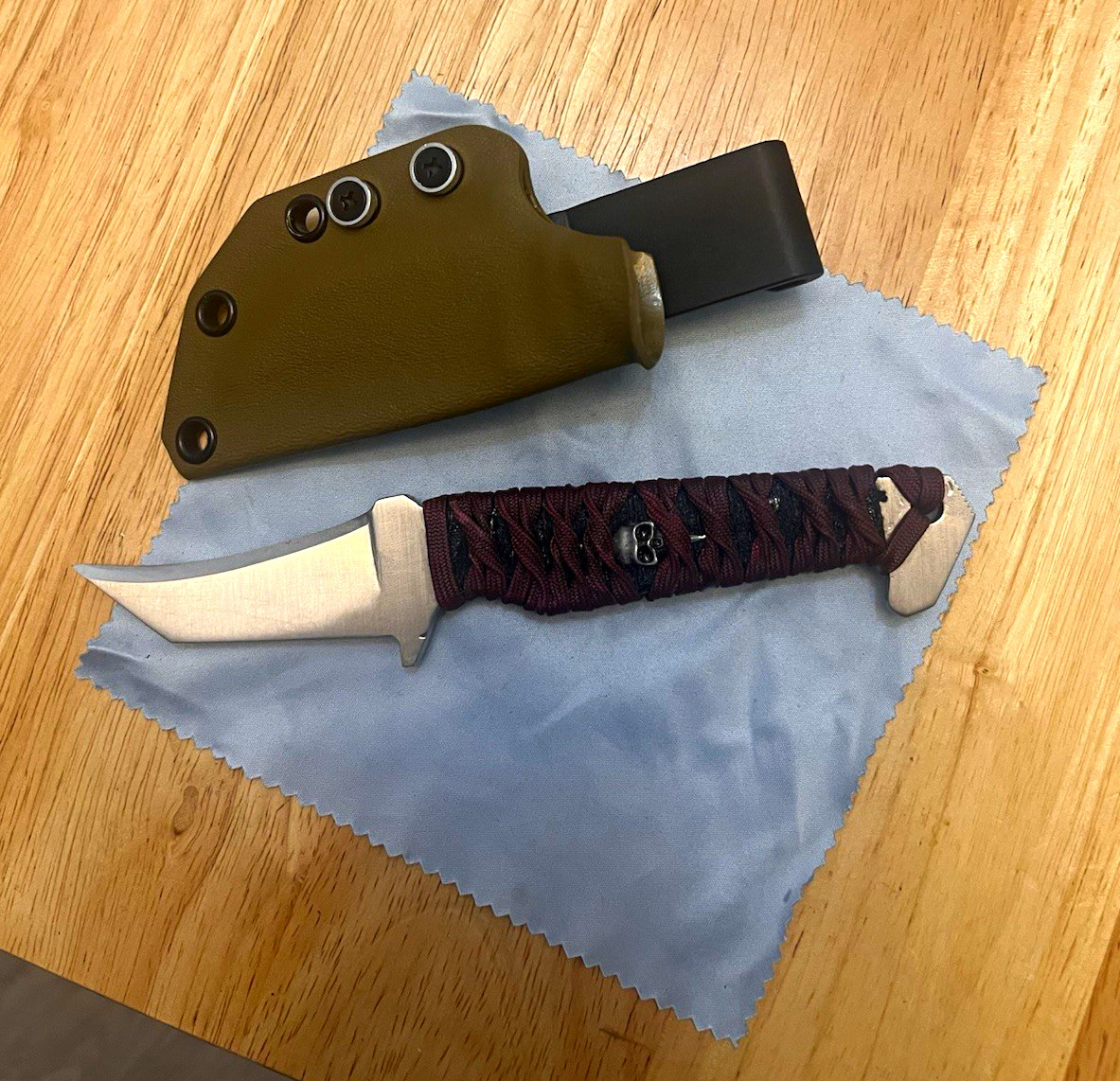 Heart & Steel co. Reverse edge fixed blade knife w/Tsukamaki wrap.