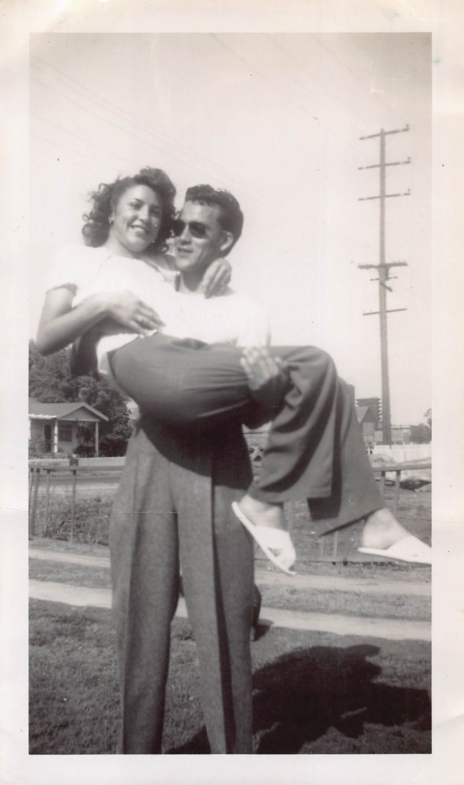 Young Man Lifting Holding Woman Front Yard 1940s Photo White Shirt Sunglasses