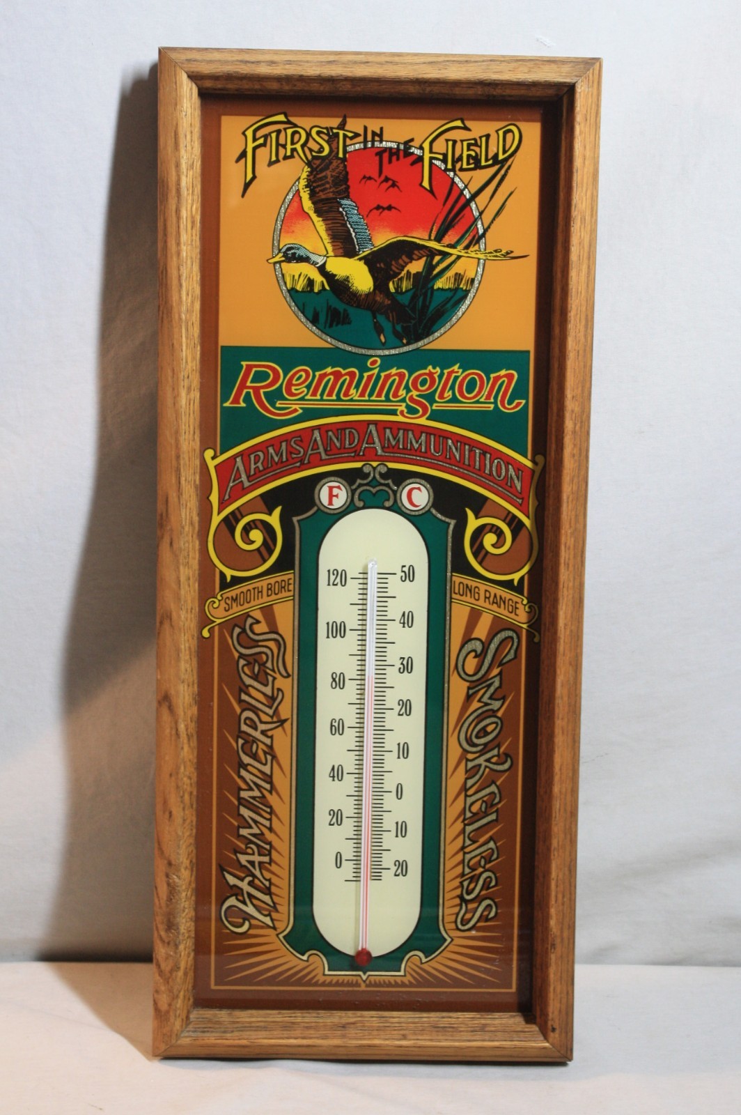 Vintage 80s, Remington Arms and Ammunition oak framed and glass Thermometer