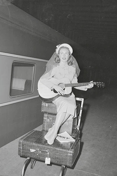 Tourist Jeanne Crain film star arrives Grand Central photo 