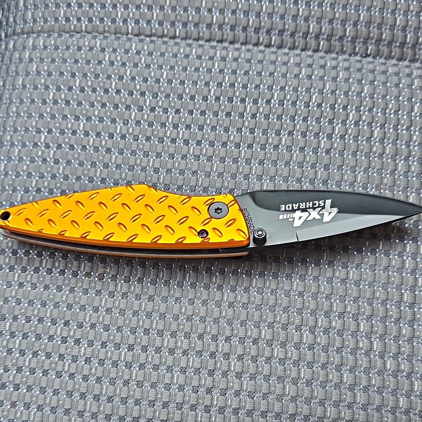 Schrade 4x4 Orange/Black Aluminum Handle SS Plain Drop Point Liner Clip