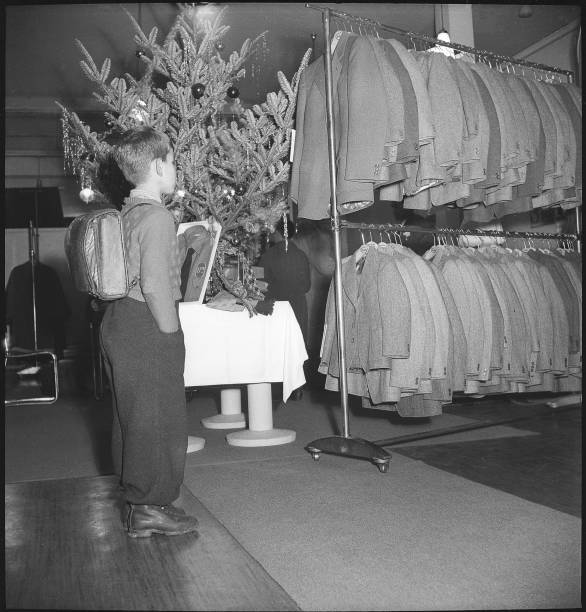 Boy in front of clothes from the schoolboy s cloth 1949 Old Photo