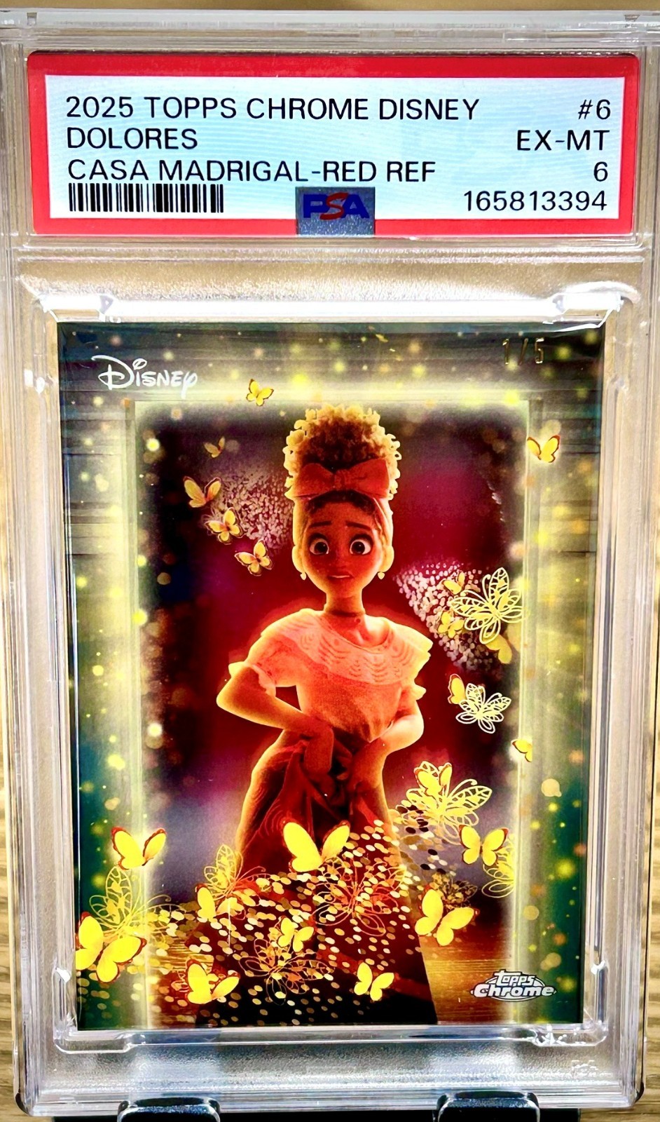 2025 Topps Chrome Disney Dolores Casa Madrigal Red Refractor 1/5 Alpha PSA 6