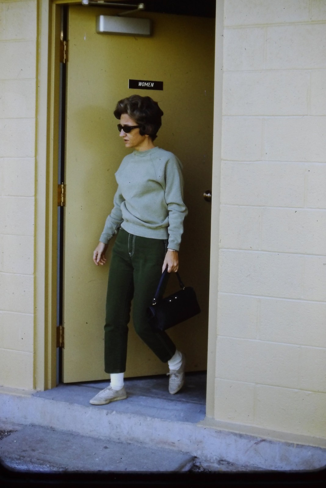 c1960's 35mm Slide, Woman Sunglasses Handbag Pants green black Doorway Sign