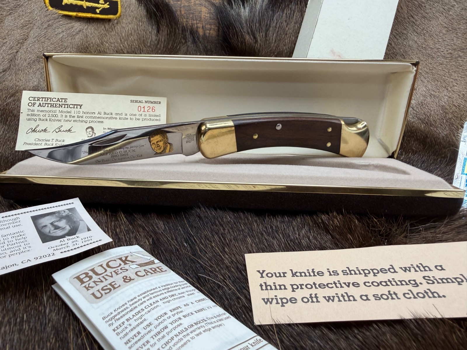 1991 Buck 110 Knife With Rosewood  Handles  Stainless Blade Mint Clamshell Case