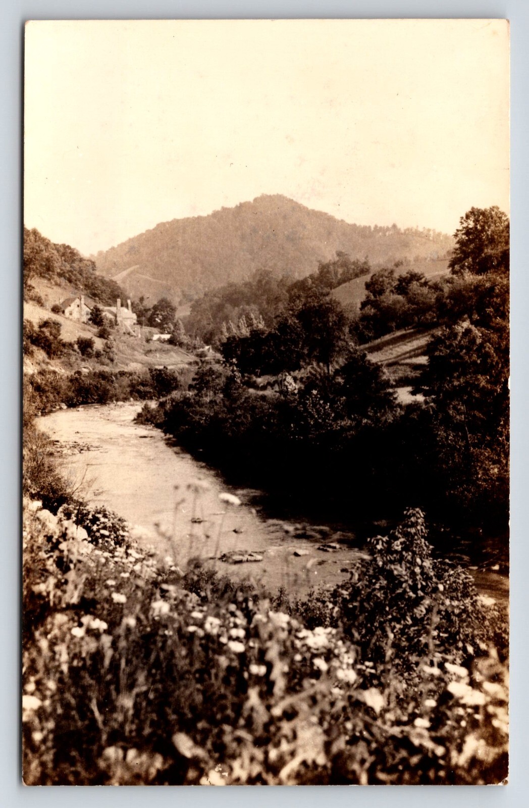 Postcard Unidentified RPPC, Scenic River Mountain View, Houses Beyond Riverbed