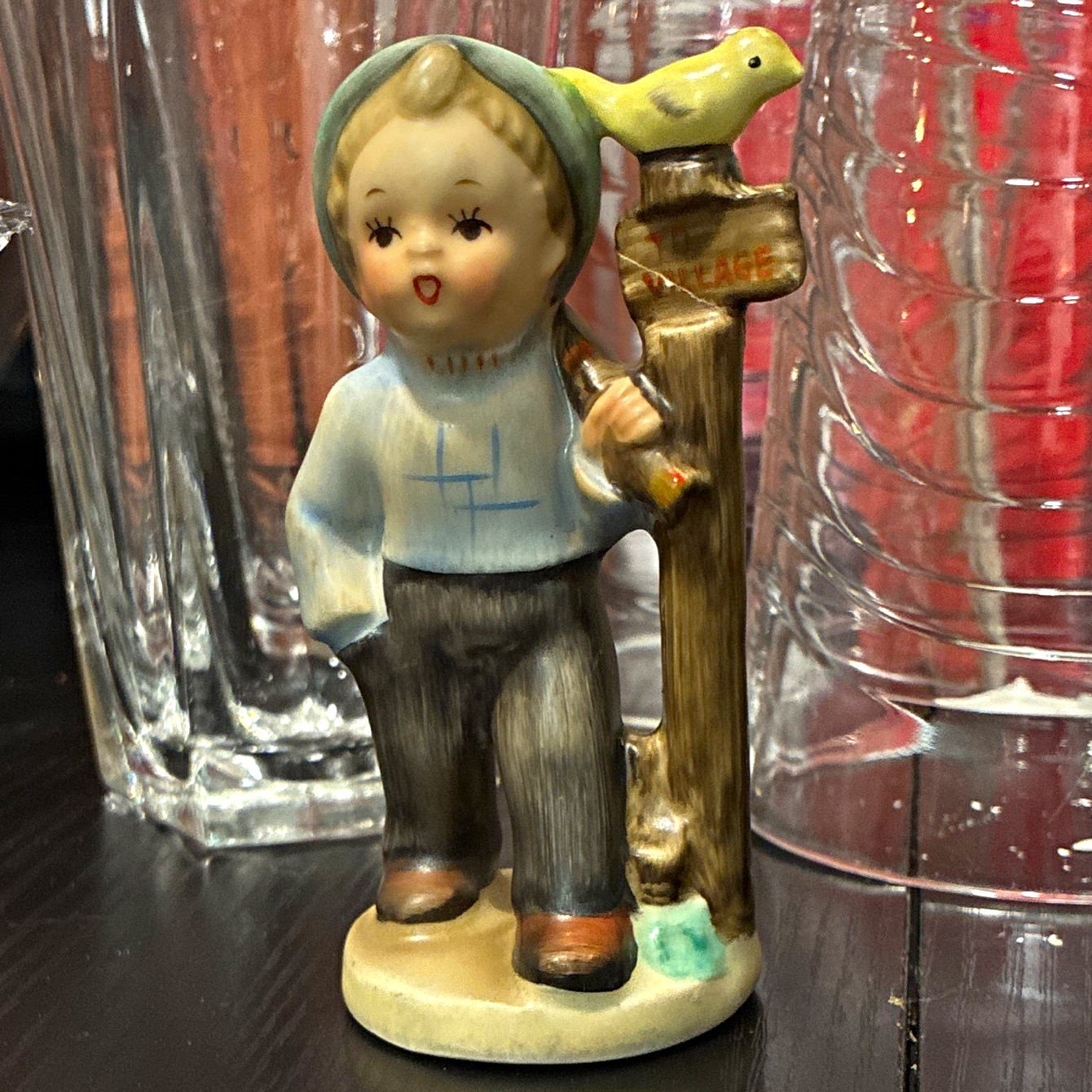 Hand Painted Ceramic Boy Figurine with Bird on Signpost, Signed, Multicolor