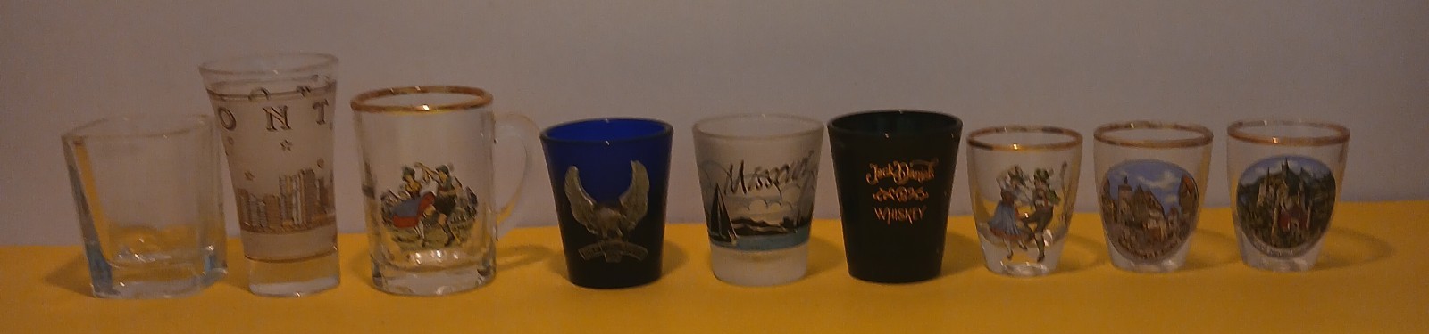 # Vintage Souvenir & Branded Shot Glasses (Lot of 9)