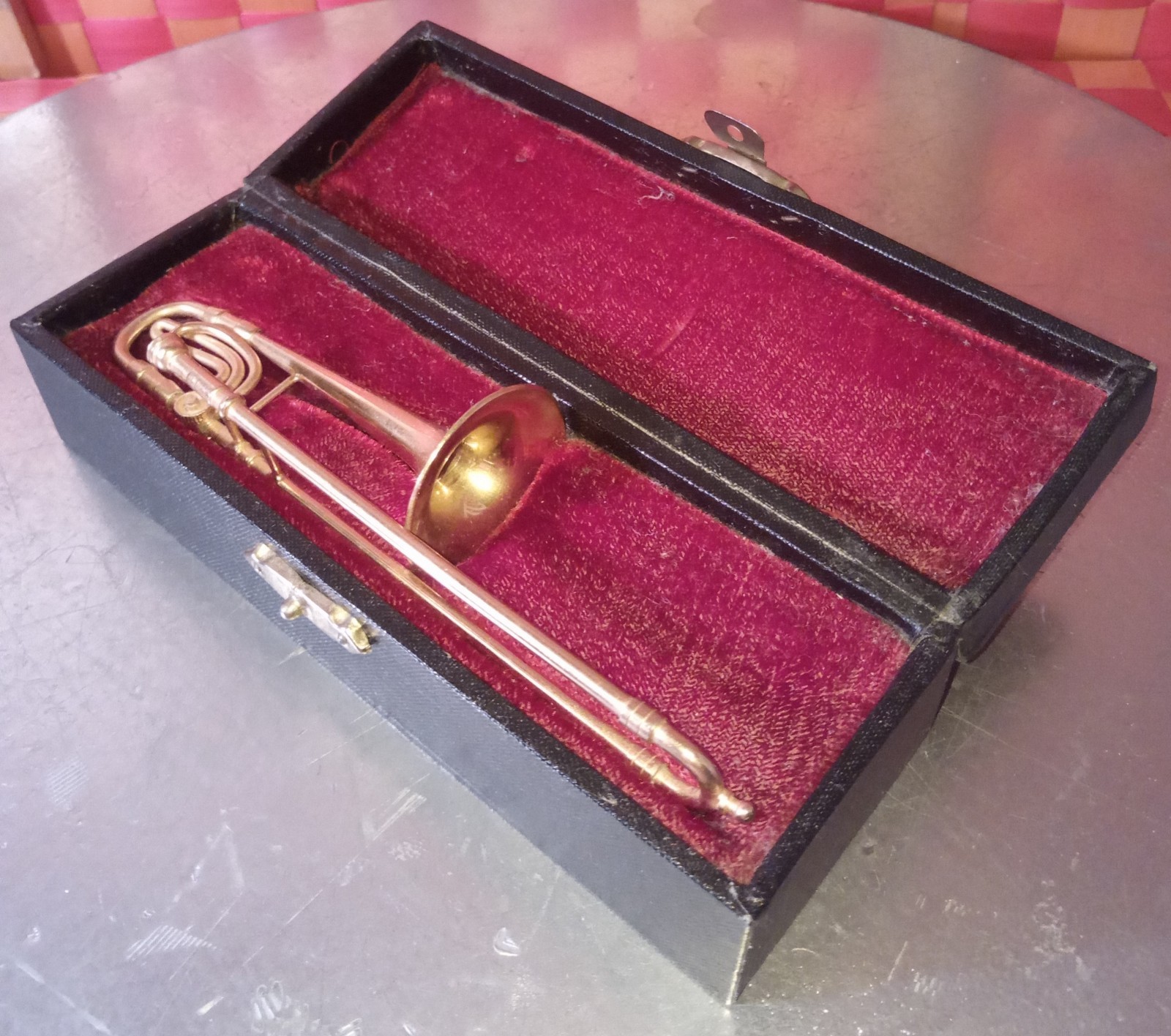 Instrument décor, vtg Trombone in casing w/red velvet material in orig. wood box