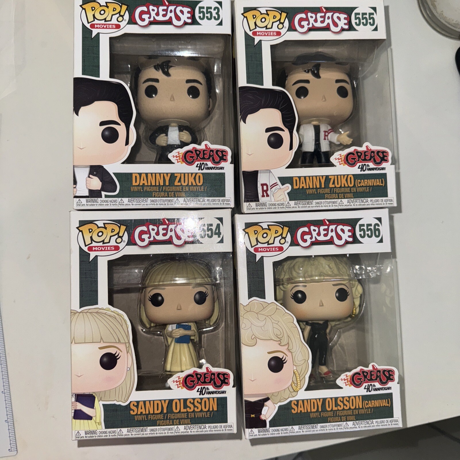 Grease - Danny Zuko #553, #555, Sandy Olsson #554, #556 - Pop Vinyl Movies Set