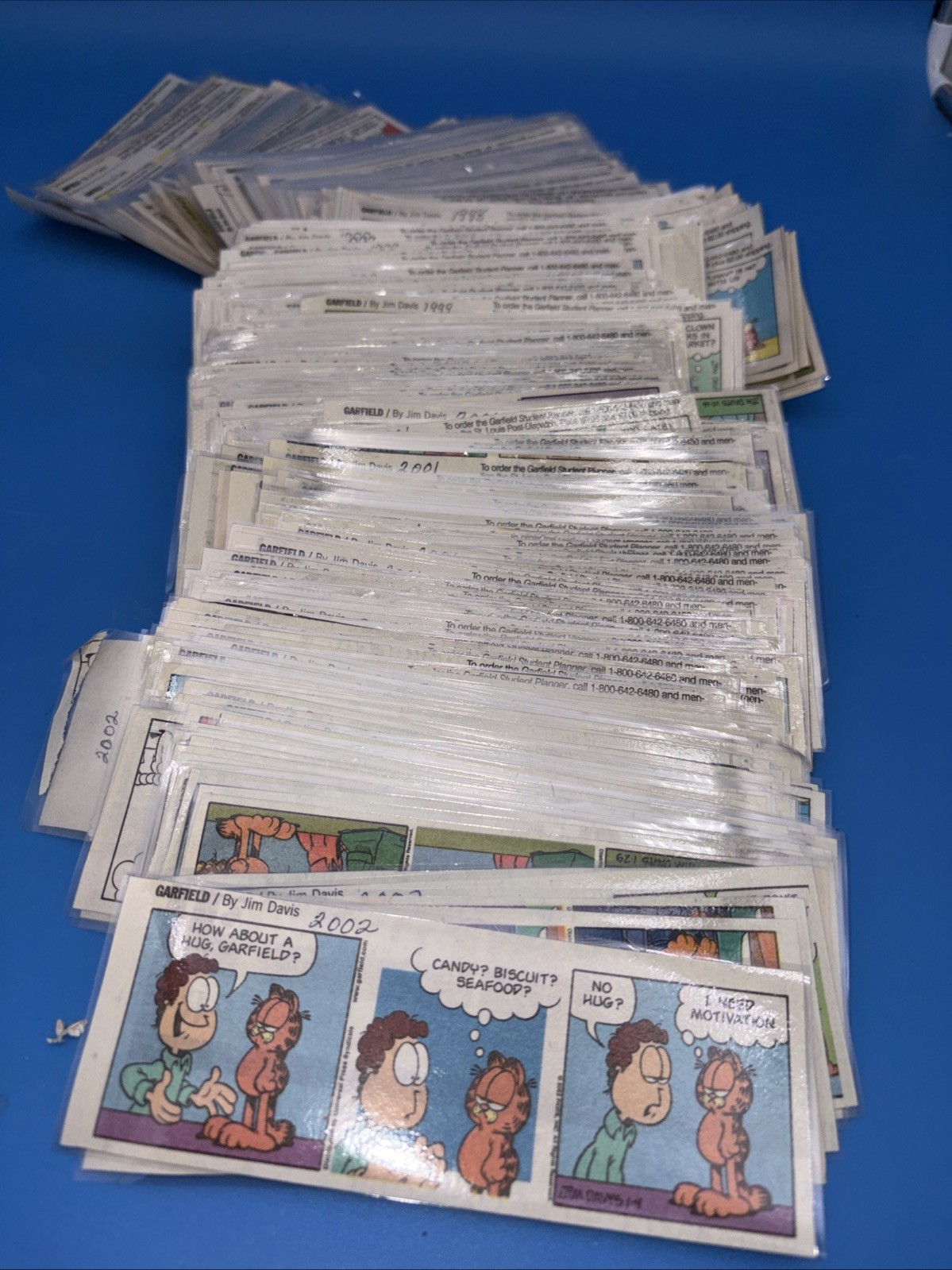 Approximately 700 LAMINATED Garfield Collection Comic Strip Clippings 1997-2002